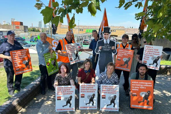 ASDA workers and life size cut out of boss Manjit Dale, will hold photo call at Lewisham Asda store over asset stripping